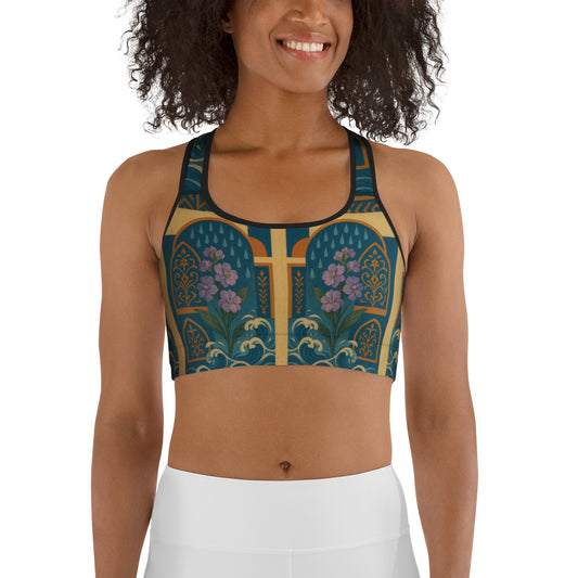 Woman wearing a patterned sports bra and white pants on a white background