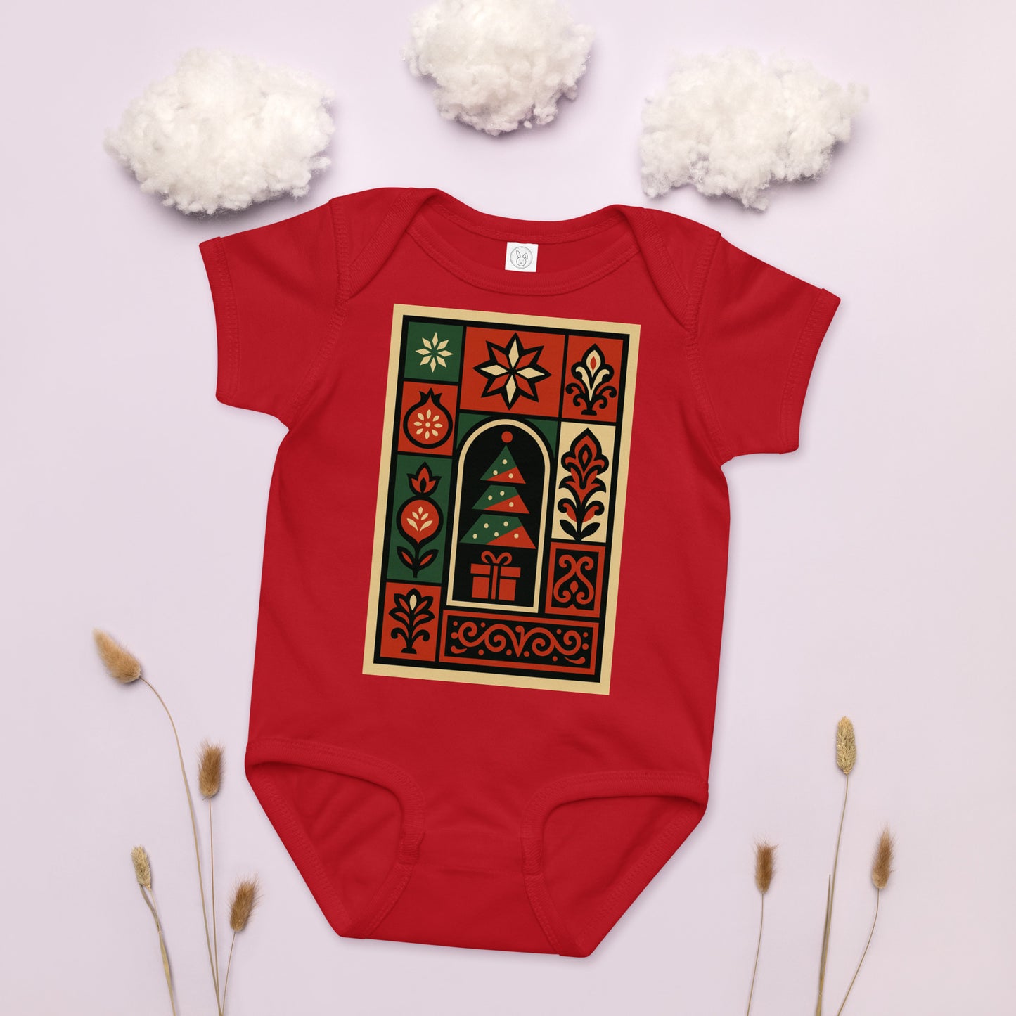 Red baby onesie with a festive design on a light background
