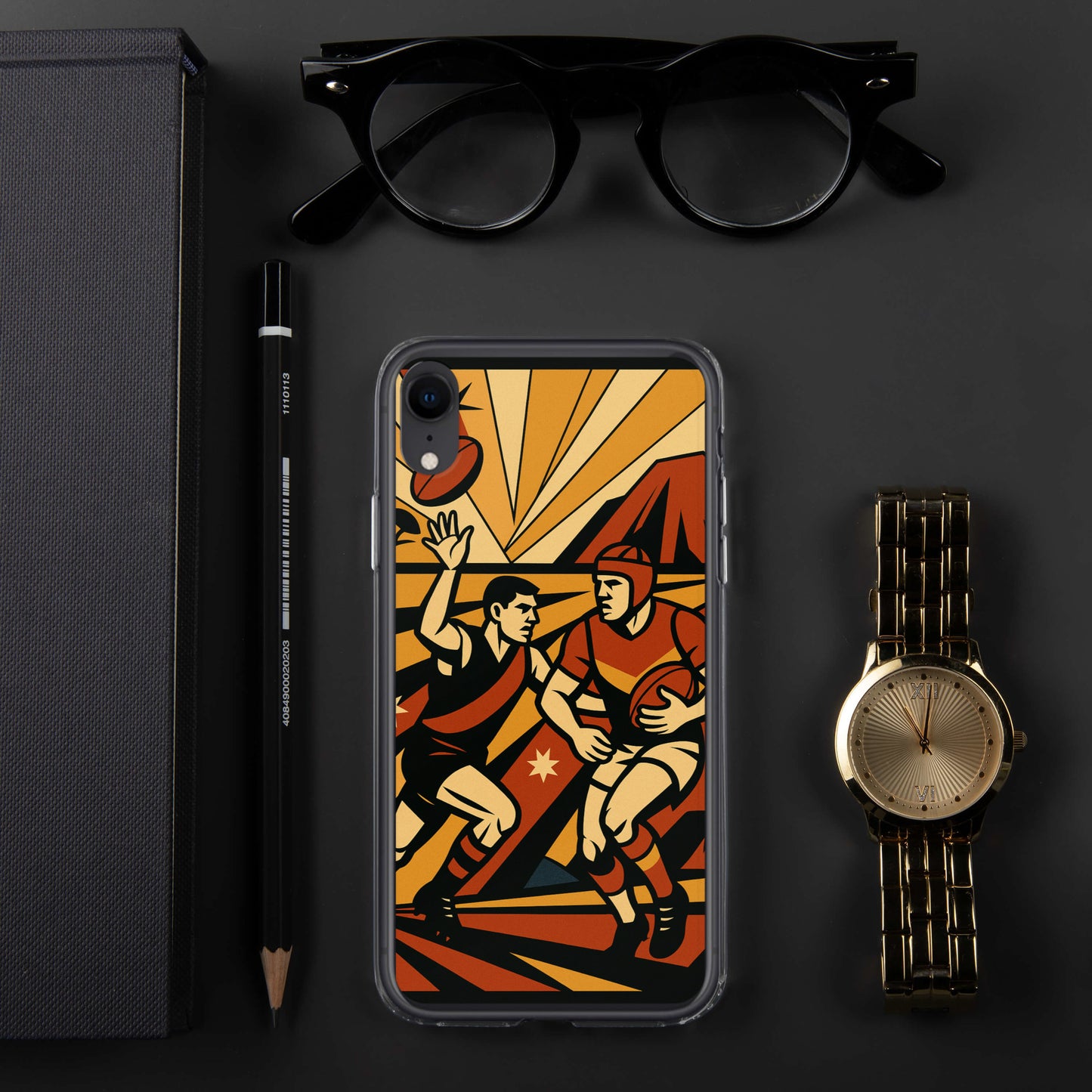 Phone case with sports design on a dark surface with glasses, pen, and watch.