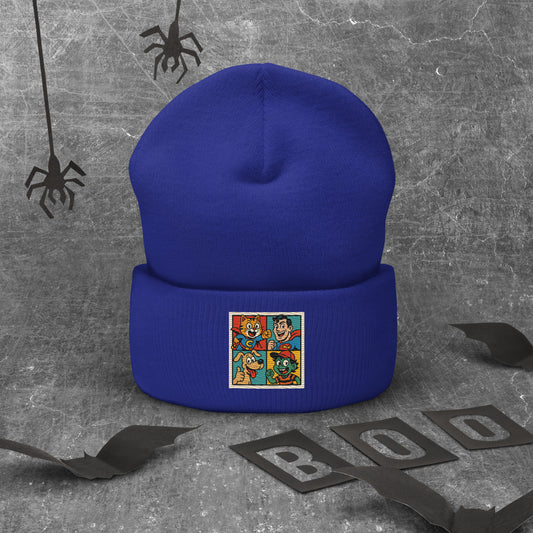 Blue beanie with a colorful patch on a gray background with spider decorations.