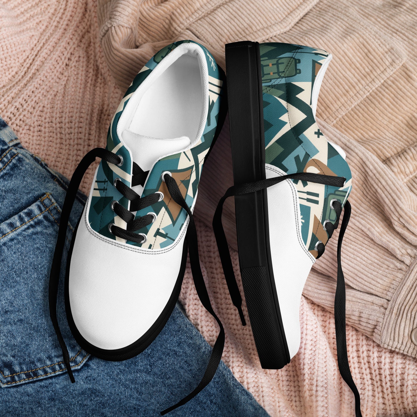 White sneakers with geometric pattern on a beige textured surface