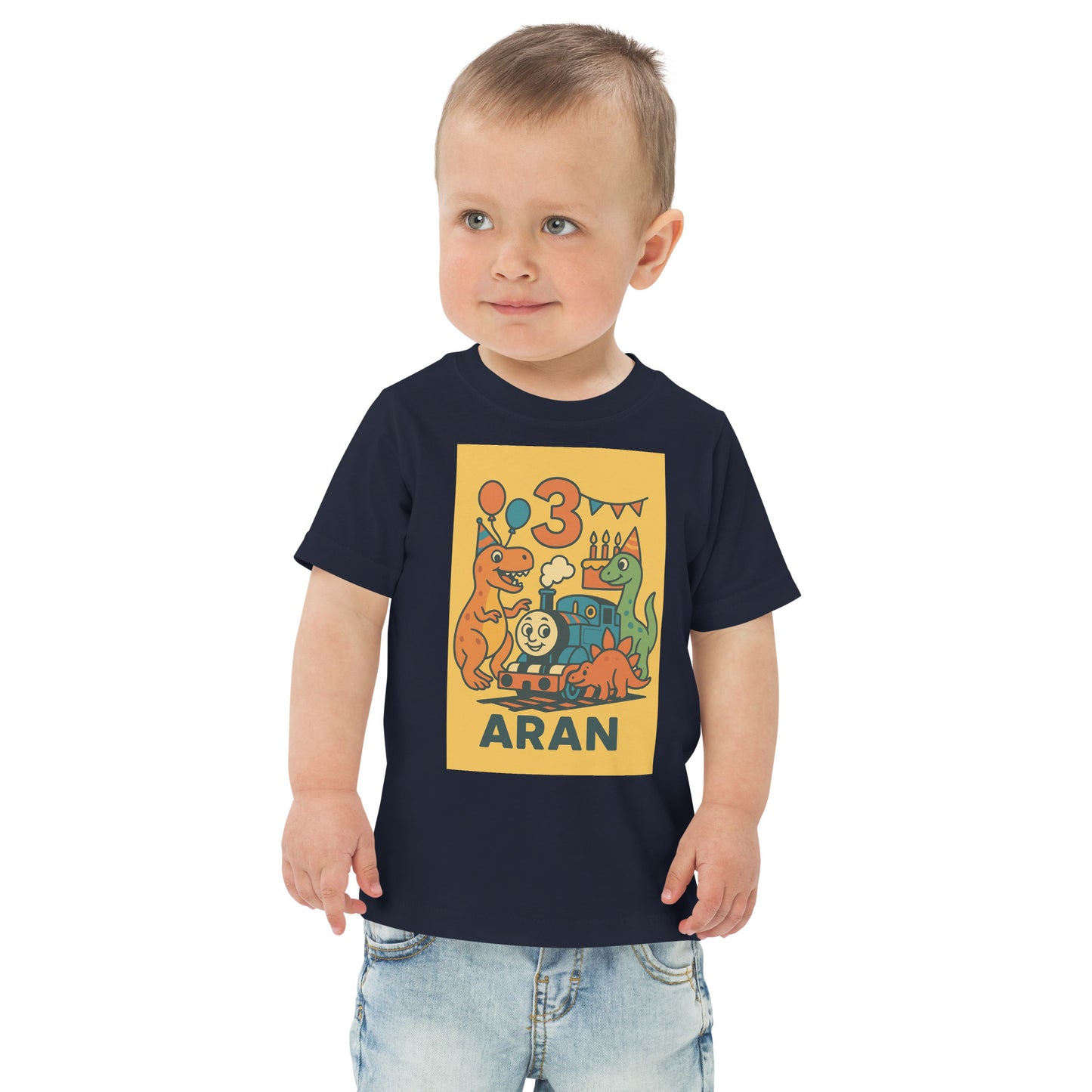 Child wearing a navy blue t-shirt with a colorful dinosaur design and text on a white background