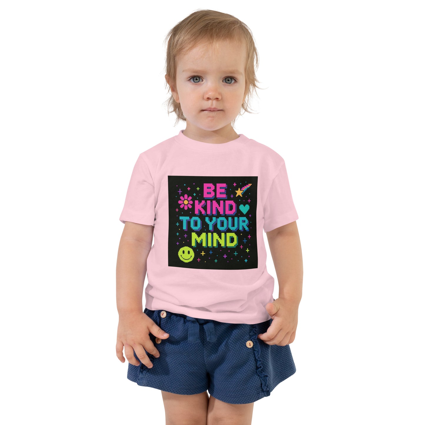 Child wearing a pink t-shirt with 'Be Kind To Your Mind' text and graphics on a white background