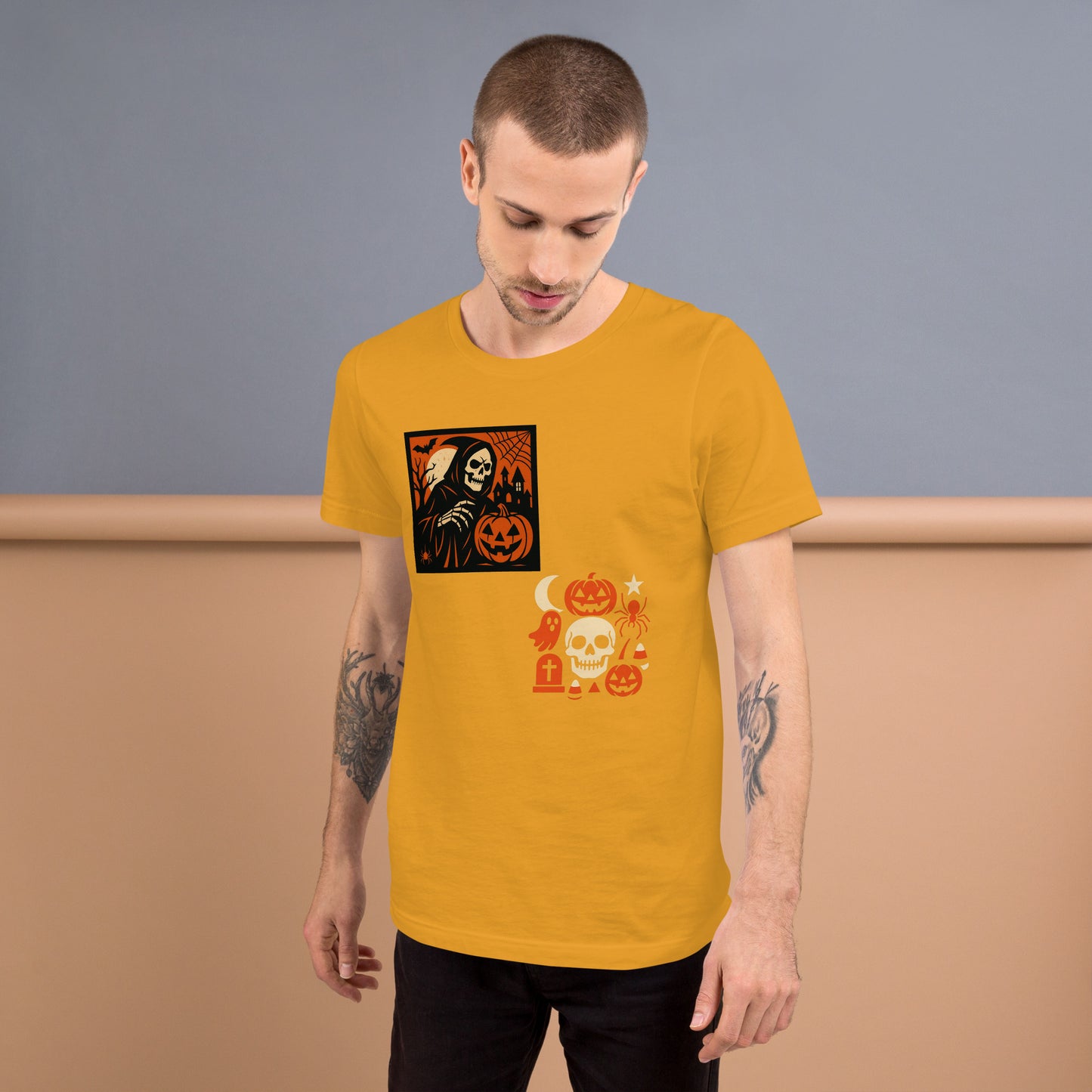 Man wearing a yellow t-shirt with Halloween-themed graphics against a plain background