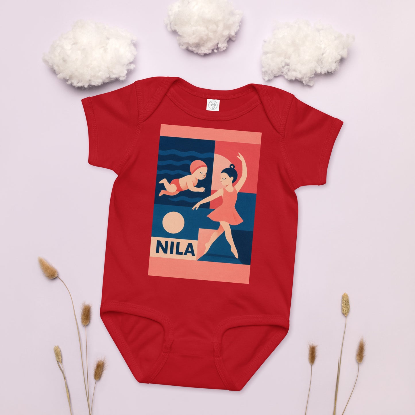 Red baby onesie with a graphic design and 'Nila' branding on a light background.