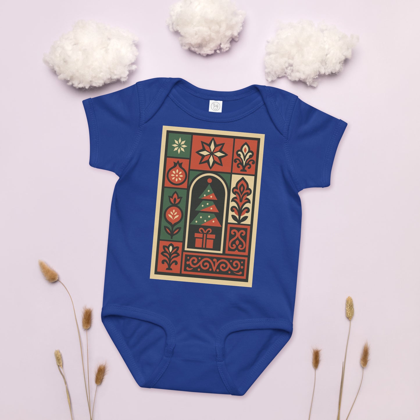 Blue baby onesie with a festive design on a light background