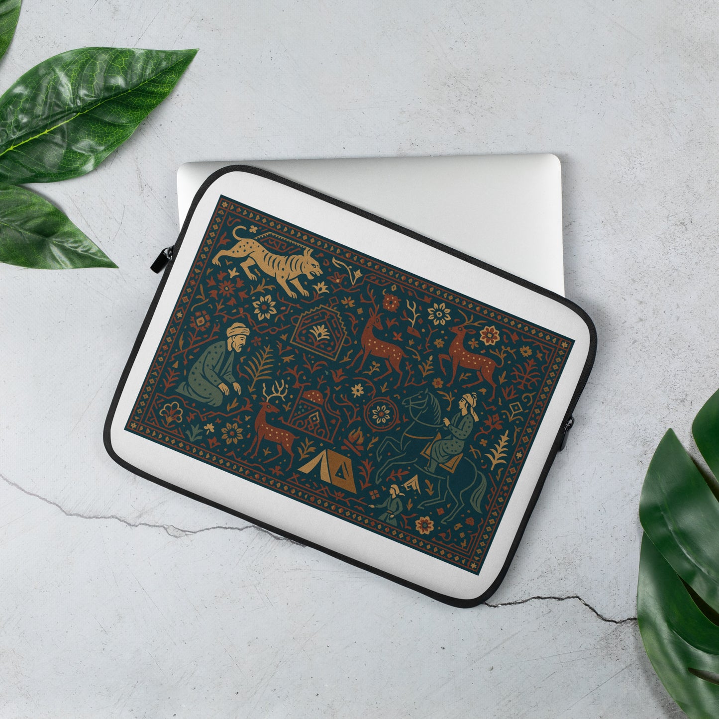Decorative laptop sleeve with nature-themed design on a light gray surface with green leaves.