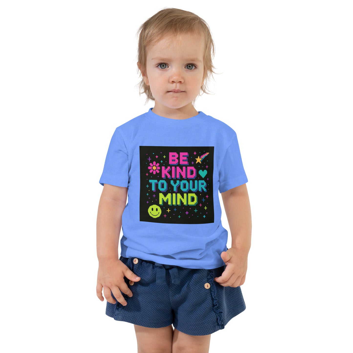Child wearing a blue t-shirt with a colorful message on a white background