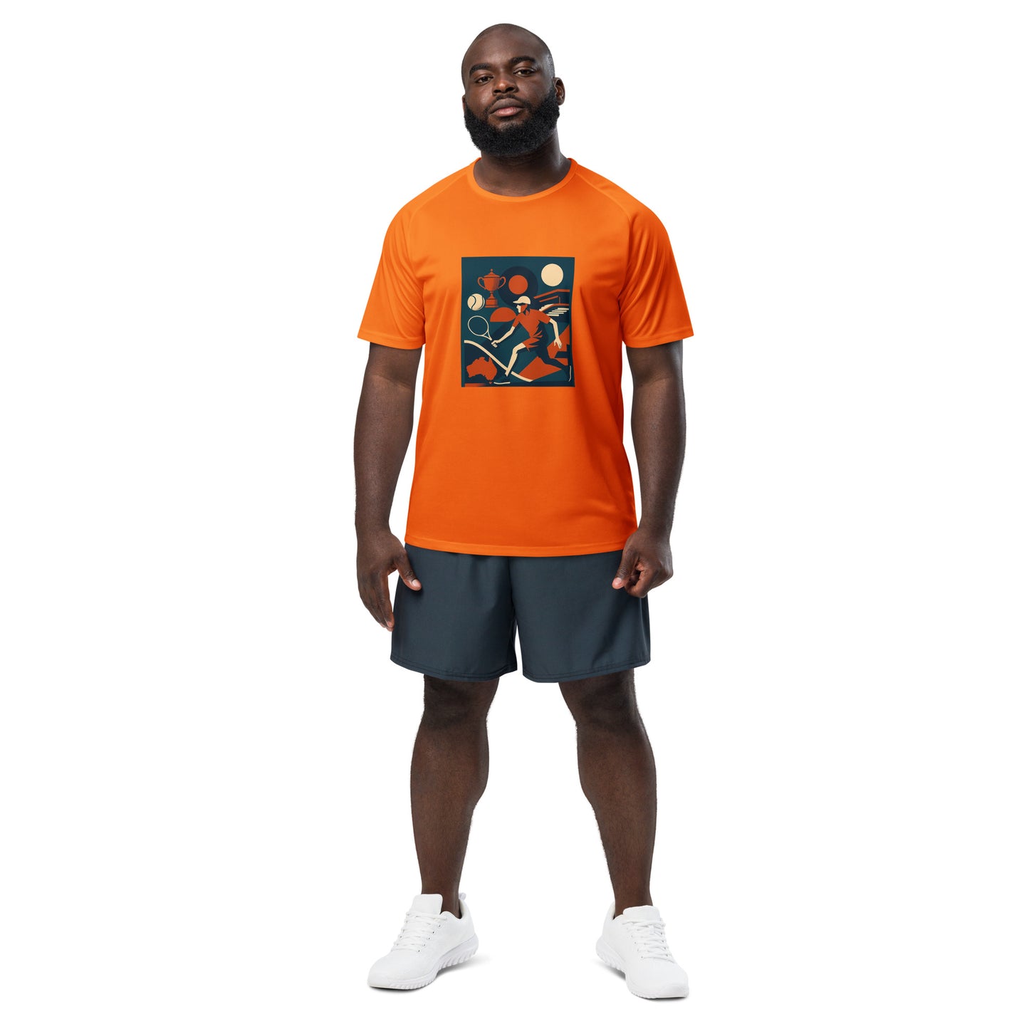 Man wearing an orange tennis t-shirt with a graphic design and dark shorts on a white background