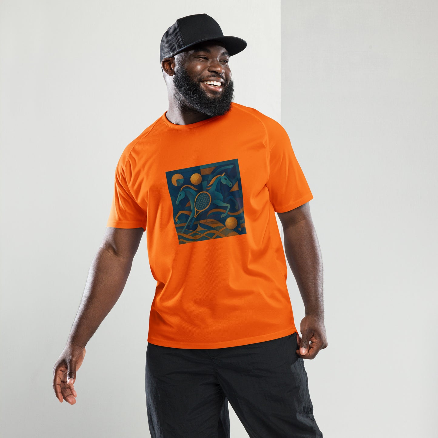 Man wearing an orange t-shirt with a graphic design on a plain background