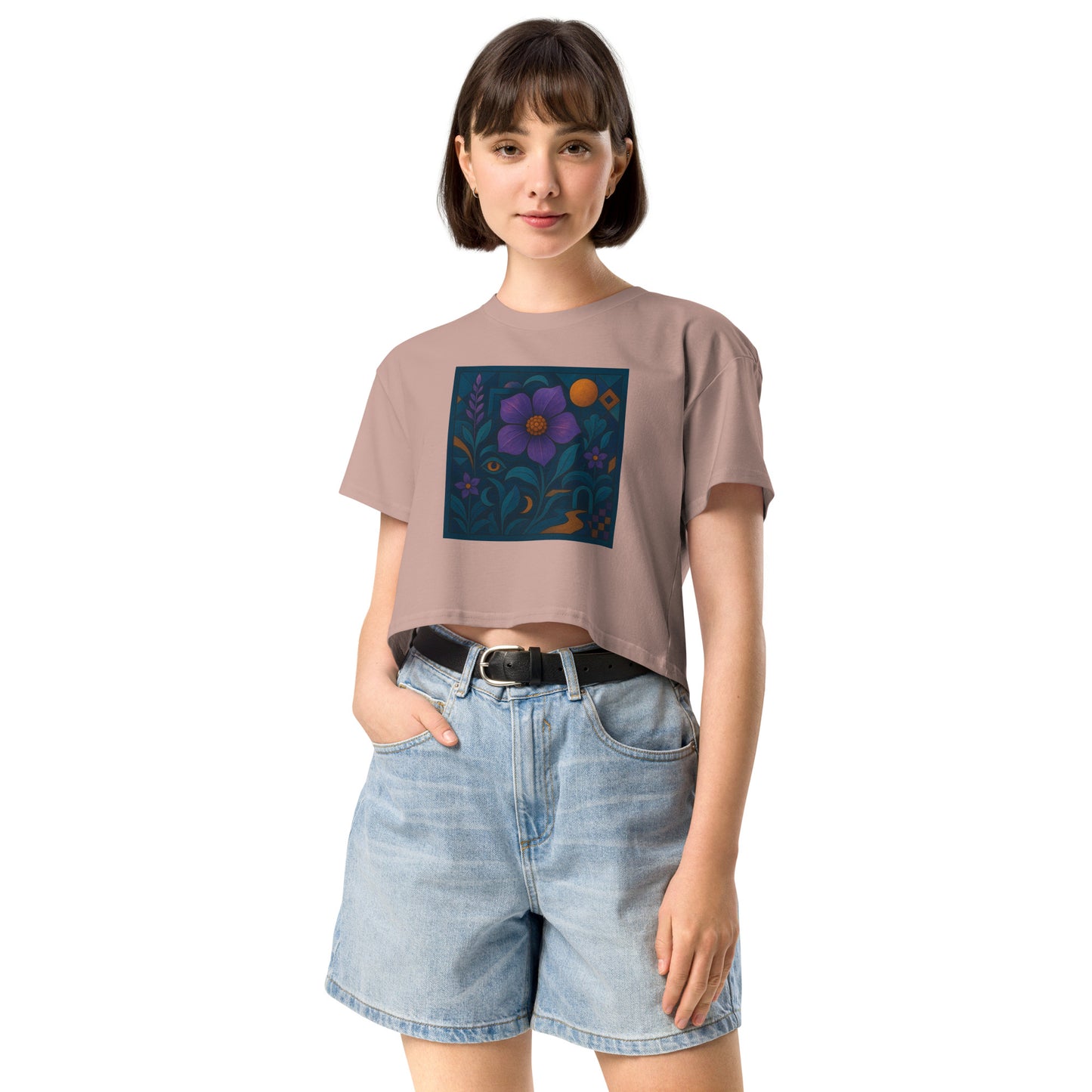 Person wearing a  t-shirt with a colorful flower design and denim shorts on a white background