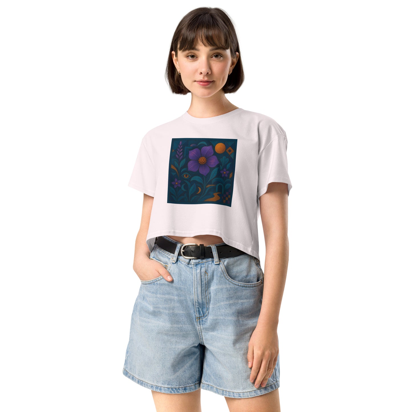 Person wearing a white t-shirt with a colorful flower design and denim shorts on a white background