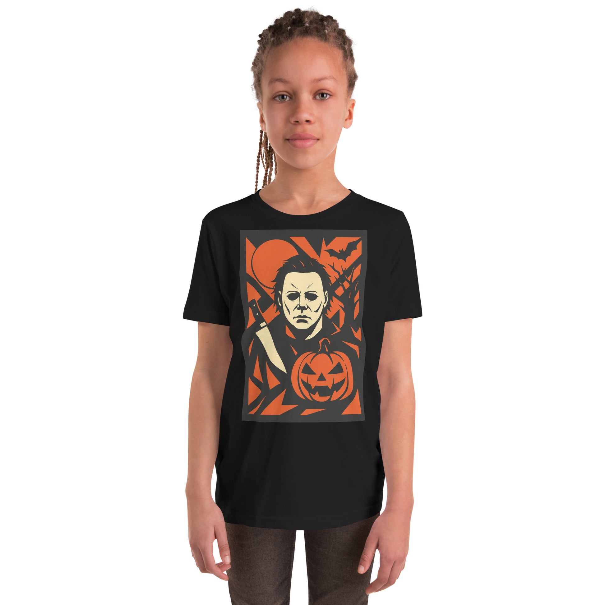 Child wearing a black t-shirt with a graphic design of a face and pumpkin.